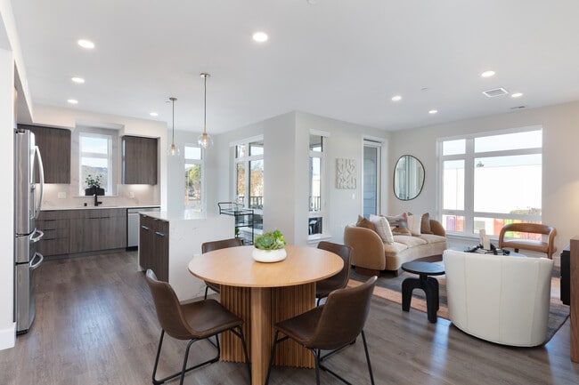Signature Collection living and dining areas with hard surface flooring throughout