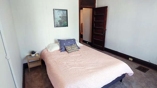 Bedroom with queen bed and large closet. - 1922 Bigelow St Unit Apt 2