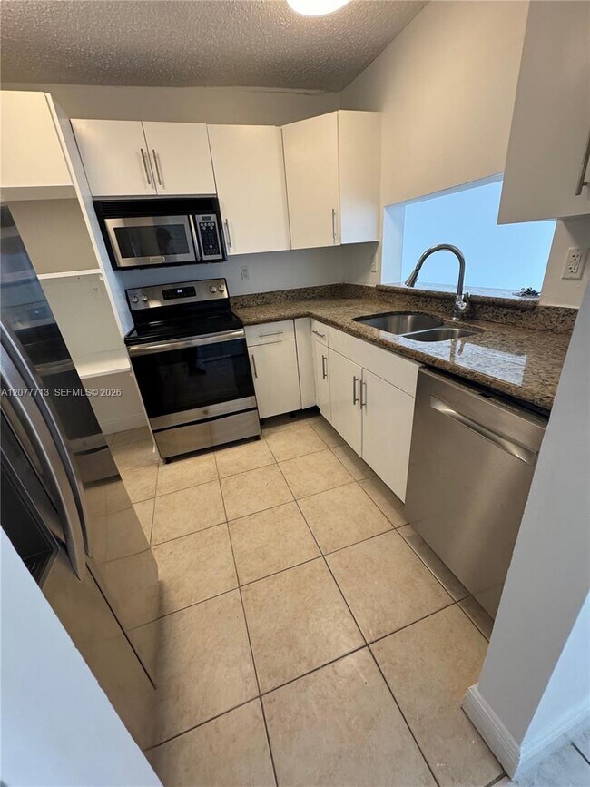 Photo - 488 NW 165th St Unit B-412