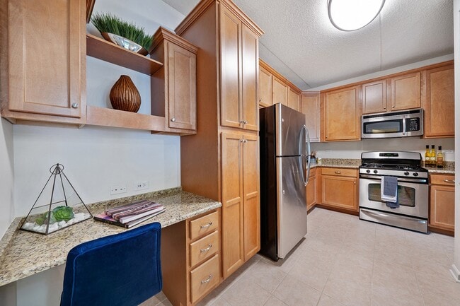 Wood-accent kitchen with stainless steel appliances