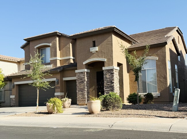 Spacious two-story home with a three-car tandem garage. - 1177 W Laredo Ave