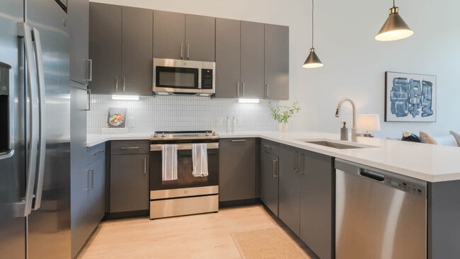 Kitchen with Stainless Steel Appliances and Dark Cabinets