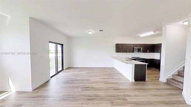 Building Photo - 15650 SW 136th St Unit 207