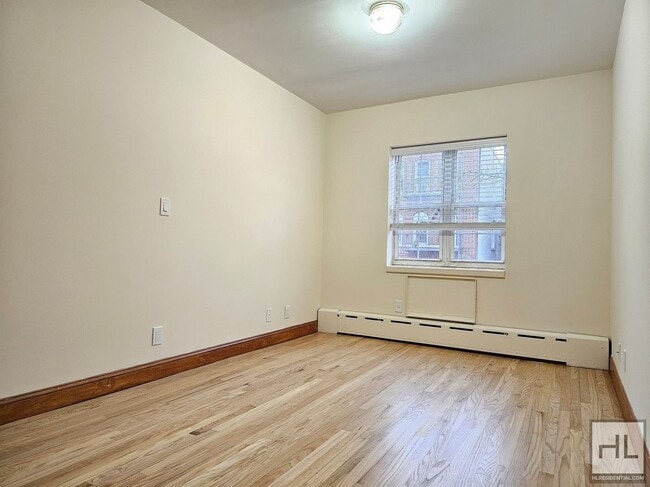 Photo - Renovated 1-Bedroom with Balcony | 2nd Floor | Prime Woodside/Sunnyside Location Unidad 2