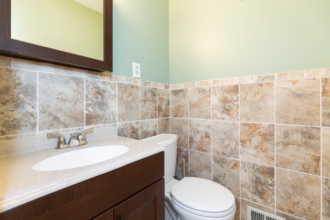 Photo - Spacious end-unit three-level townhome fea...