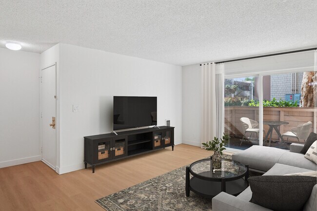 Renovated Package I living room with hard surface flooring