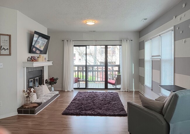 Living area view to balcony - 9033 J M Keynes Dr Unidad #42