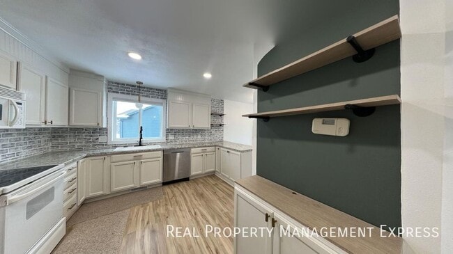 Photo - Spacious 4BR, 2BA Gem with Fireplace and Open Basement