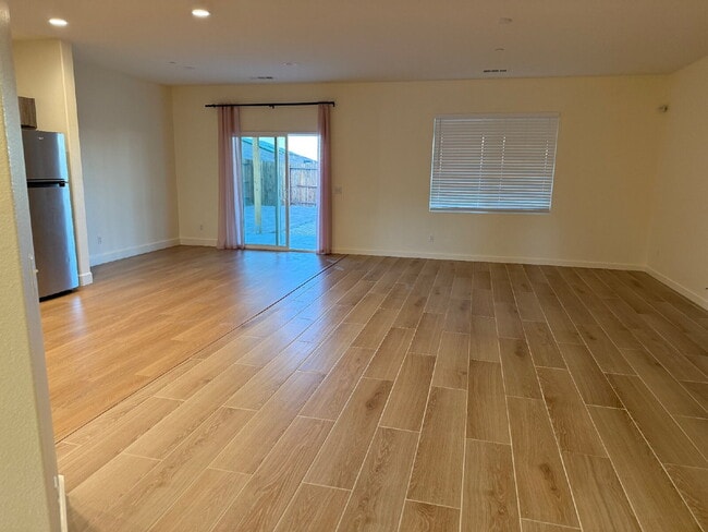 Photo - Solor Savings!  Beautiful modern interior with open floorplan for entertaining.  Large backyard w...