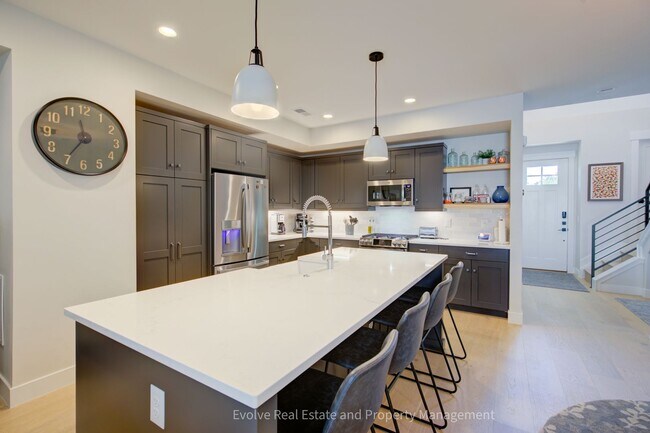 Photo - Evolve Real Estate: Discover Your Ideal Townhome With 4 Beds/4 Baths and Two-Car Attached Garage ...