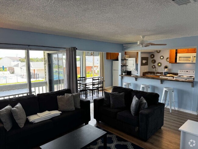 Building Photo - "Coastal Comfort Awaits: Spacious 2-Bed, 2... Unit 241 Rental