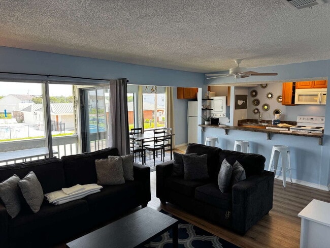 Building Photo - "Coastal Comfort Awaits: Spacious 2-Bed, 2... Unit 241 Rental
