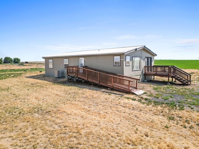 Building Photo - Country Living with a Huge Shop - 3BR on Acreage, Livestock Welcome!