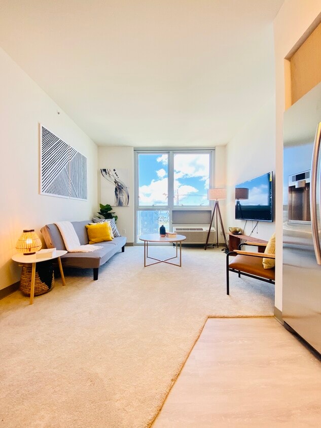 Cozy living room with a beautiful ocean view of Ward Village & the private beach - 988 Halekauwila St (Honolulu, HI)