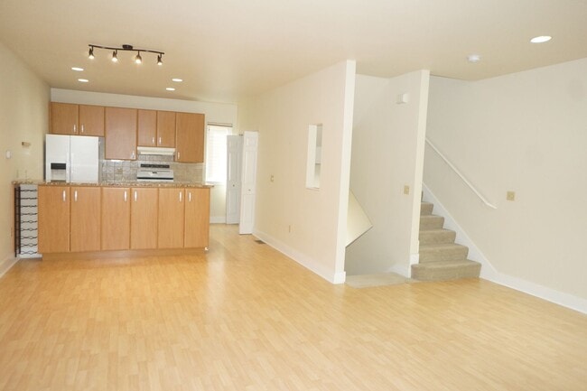 Photo - Beautiful 2 bedroom Belmont Condo. 3 Stories, 1 car garage, open floor plan, a/c. Amazing unit!