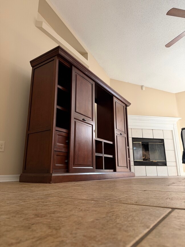 Living room with fireplace as a charming focal point - 6281 Hunters Ridge Dr