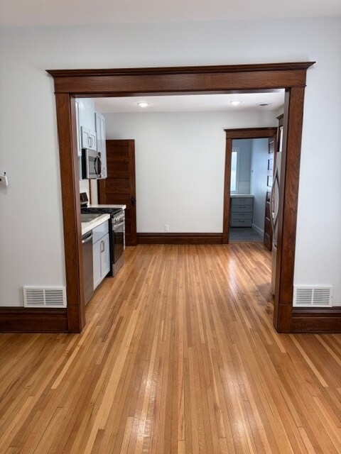 View from the living room into the kitchen. - 623 Pierce St NE Unit Upper
