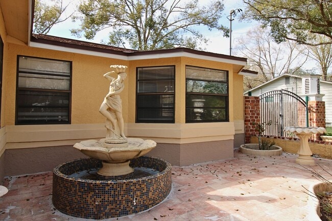 Photo - Stunning 3-Bed, 2-Bath Spanish-Inspired Custom Home with Elegant Gardens & Fountains