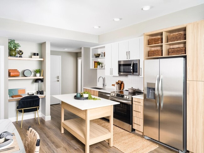 An open kitchen at Modera McGavock, featuring upscale finishes and flexible space, with quick access to Nashville’s dining, music, and everyday essentials.