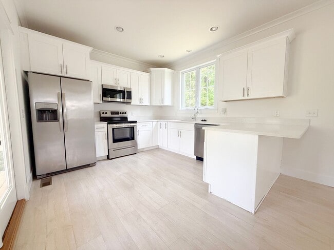 Photo - Pet-Friendly 3-Bedroom Home with Modern Features, Covered Deck & Bright Open Space