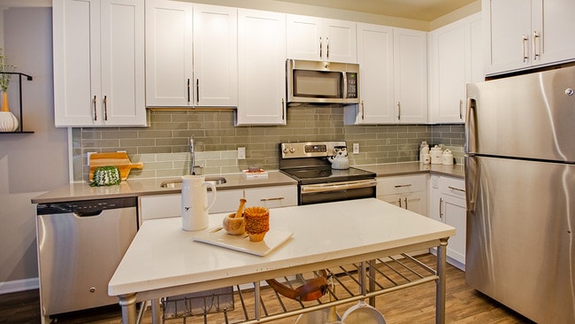 Chef-inspired kitchens outfitted with quartz counter tops and elegant islands