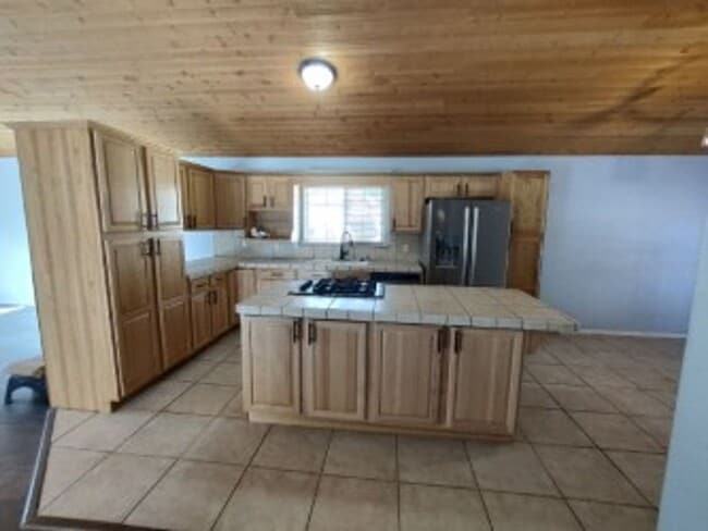 Photo - Move-In Ready 3-Bedroom Cabin-Style Home with Huge Yard, Deck & Garage in Pine Mountain Club