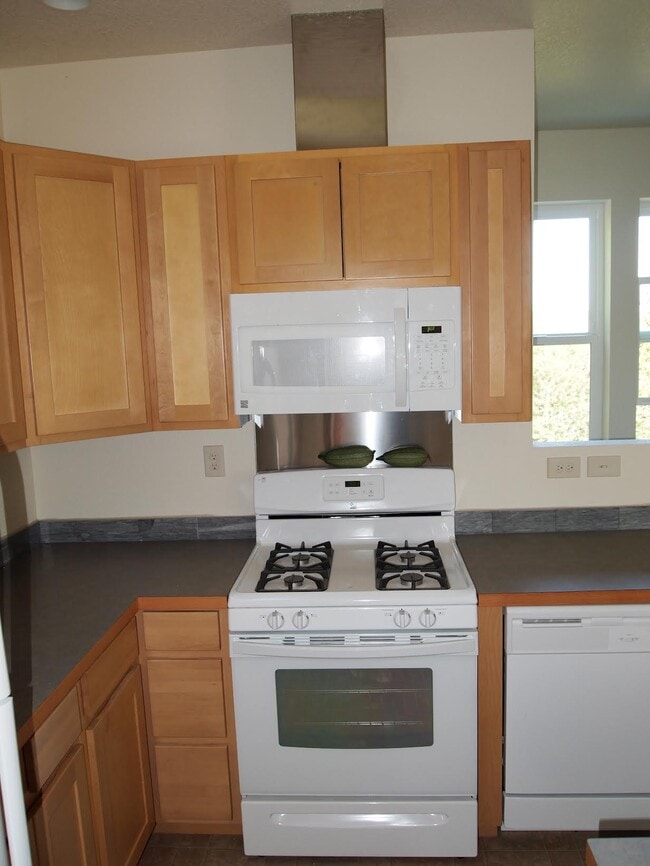 Kitchen: Gas range, fan, microwave, Dishwasher, Lots of daylight from window along access stairway - 6924 SE 108th Ave Unit LOFT Bike Run Paradise