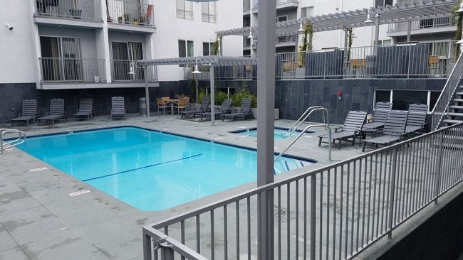 Sundeck, heated pool and hot-tub! - Sunset West Apartments Unit 209