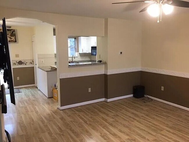 Photo - Spacious 3BR Townhome with Walkout Basement, Deck, Fenced Yard, Central A/C + Assigned Parking