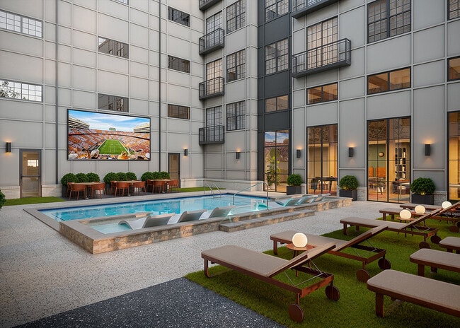Resort-Style-Pool-Courtyard-with-Jumbotron-Signature-on-Grand-Apartments-Near-UTK