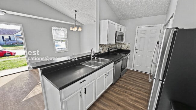 Photo - 4 Bed, 2.5 Bath Home with Fenced Yard & Garage / Pet-Friendly / Available Now!