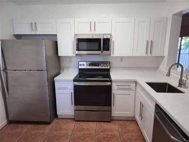 Building Photo - 4744 NW 114th Ave Unit 202