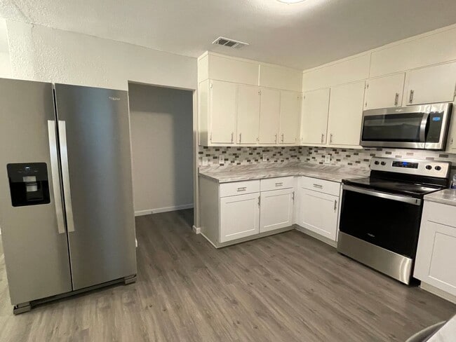 Photo - Available Now! Updated 4BR Home with Large Yard, Storage Shed & Modern Finishes