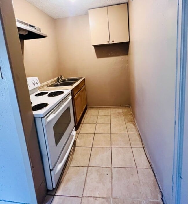 Photo - EFFICIENCY UNIT WITH TILE FLOORING THROUGHOUT