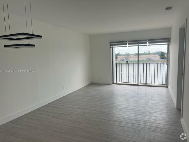 Building Photo - 8560 N Sherman Cir Unit 408 Rental