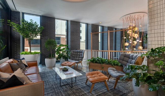 Your vibrant entry to your community is designed with elements of wood, stone, and water