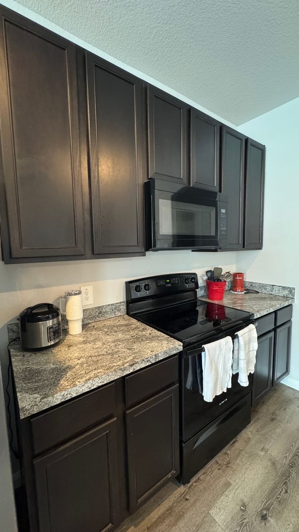 Photo - Entertainer’s Kitchen + Oversized Primary Suite | 4 Bed House in Bryan