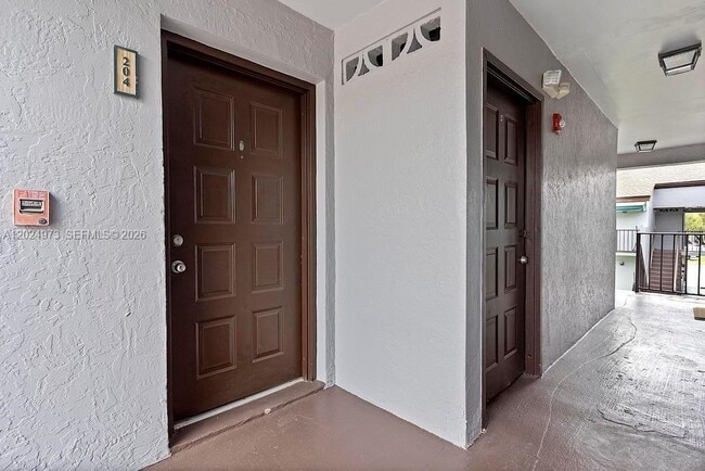 Building Photo - 7403 SW 152nd Ave Unit 204-2