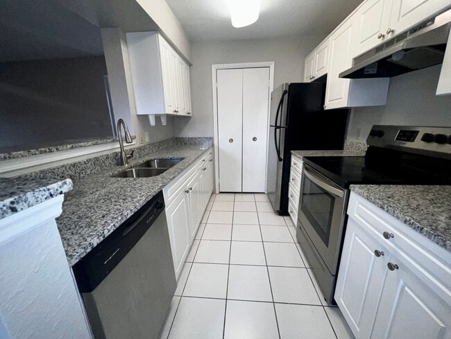 Photo - 3/2 Regency Gardens 1st Floor Condo with New Plank Fooring, Stainless Appliances, and Fresh Paint!