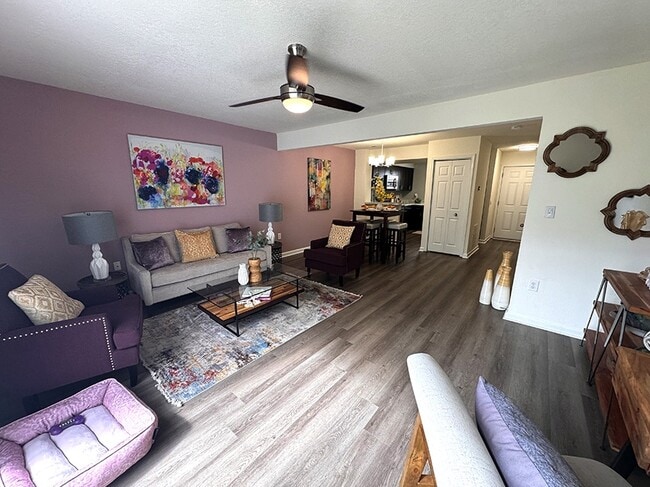 Spacious living room with luxury vinyl flooring - Devon Pointe Apartments and Townhomes