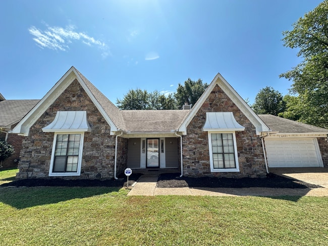 Building Photo - Grand 4BR/2BA Near Southwind | 2,438 Sq Ft, Stone Fireplace, Soaking Tub & 2-Car Garage