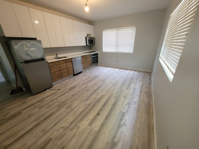 Open concept living room and dining room - 820 15th St Unit 105