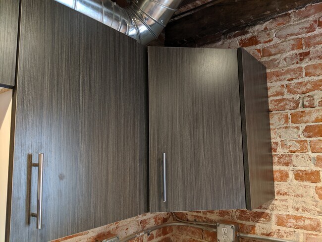 Custom made cabinets throughout apartment. - 130 E State St Unit 202