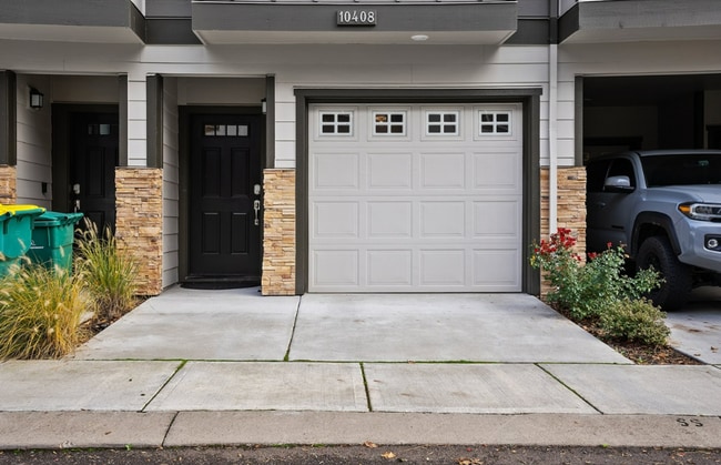 Photo - Modern 3-Bedroom Townhome-Style Home with Attached Garage, Private Patio & En-Suite Bathrooms in ...