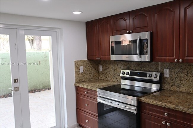 Building Photo - 10101 W Okeechobee Rd Unit 12101