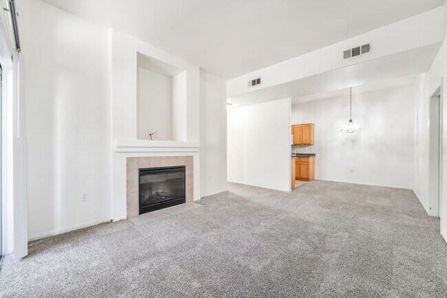 Photo - Stylish First-Floor Condo with 10’ Ceilings, Fireplace & Resort-Style Amenities!