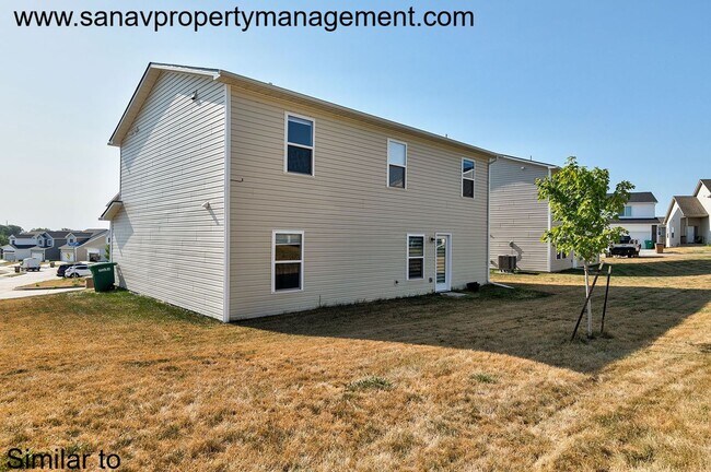Photo - Stunning 4-Bedroom Home in Prime Norwalk Location with Open-Concept Living with fenced backyard