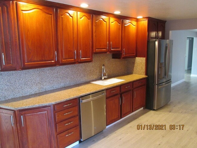 Photo - Remodeled !  Hardwood Flooring Throughout & New Carpet in Bedrooms, Tile, Granite, Large Living r...