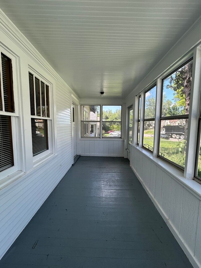 Photo - Charming 3-Bedroom Home with Finished Attic, Enclosed Front Porch & Spacious Backyard