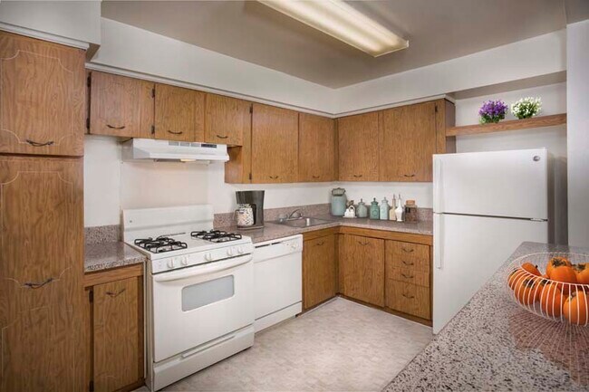 Fully-equipped kitchen at Deerfield Run & Village Square North Apartments in Laurel, MD